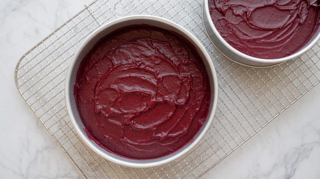 Divide the batter evenly between the pans